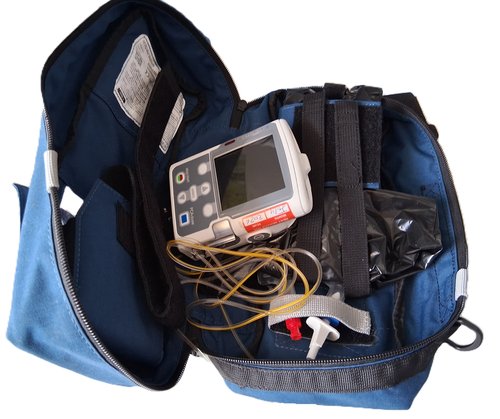 A blue fabric bag with a black zip contains a small battery powered pump with a digital display. There are yellow wires and tubing, secured in the bag with webbing straps.
